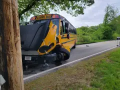 Mass. teen charged after allegedly driving head-on into school bus while on cellphone